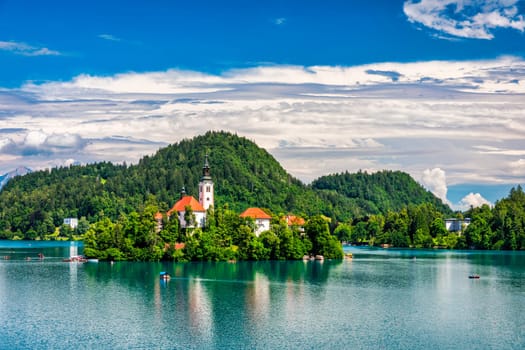 Lake Bled in Slovenia. Beautiful mountains and Bled lake with small Pilgrimage Church. Bled lake and island with Pilgrimage Church of the Assumption of Maria. Bled, Slovenia, Europe.