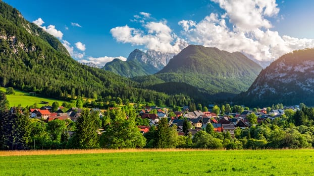 Kranjska Gora town in Slovenia at summer with beautiful nature and mountains in the background. View of mountain landscape next to Kranjska Gora in Slovenia, view from the top the town Kranjska Gora.