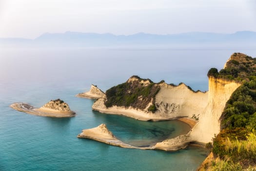 Beautiful view of Cape Drastis in the island of Corfu in Greece. Cape Drastis, the impressive formations of the ground, rocks and the blue waters panorama, Cape Drastis, Corfu, Greece, Ionian Islands.