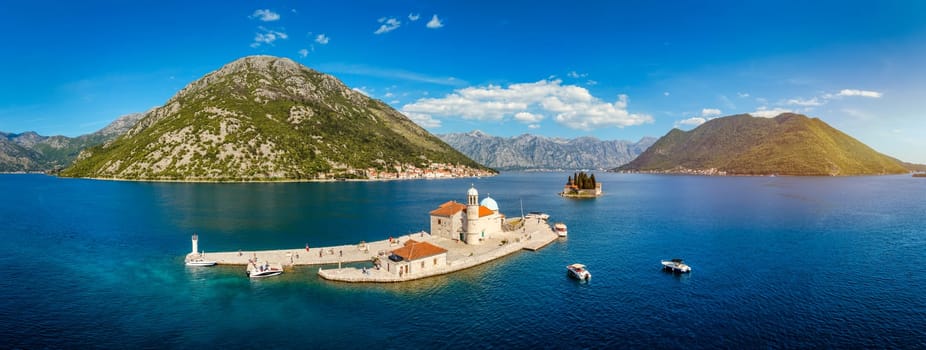 Saint George Island and Church of Our Lady of the Rocks in Perast, Montenegro. Our Lady of the Rock island and Church in Perast on shore of Boka Kotor bay (Boka Kotorska), Montenegro, Europe. 