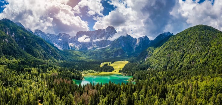 Lake of Fusine (Lago Superiore di Fusine) and the Mountain Range of Mount Mangart, Julian Alps, Tarvisio, Udine province, Friuli Venezia Giulia, Italy, Europe. Picturesque lake Lago Fusine in Italy.