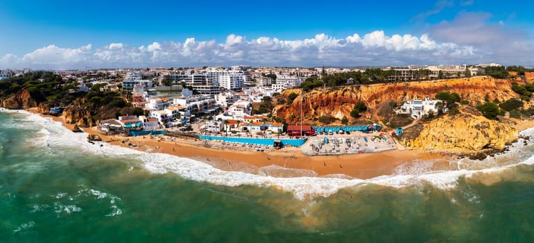 Amazing view from the sky of town Olhos de Agua in Albufeira, Algarve, Portugal. Aerial coastal view of town Olhos de Agua, Albufeira area, Algarve, Portugal.