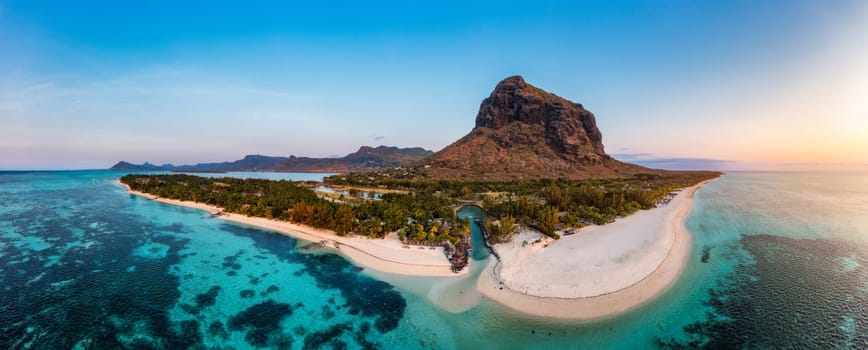 Aerial view of Le morne Brabant in Mauriutius. Tropical crystal ocean with Le Morne mountain and luxury beach in Mauritius. Le Morne beach with palm trees, white sand and luxury resorts, Mauritius.