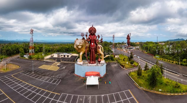 A powerful Statue of the Hindu goddess Durga Maa with a golden lion in sacred Ganga Talao. Shiva statue at Grand Bassin temple, the world's tallest Shiva temple, it is 33 meters tall. Mauritius