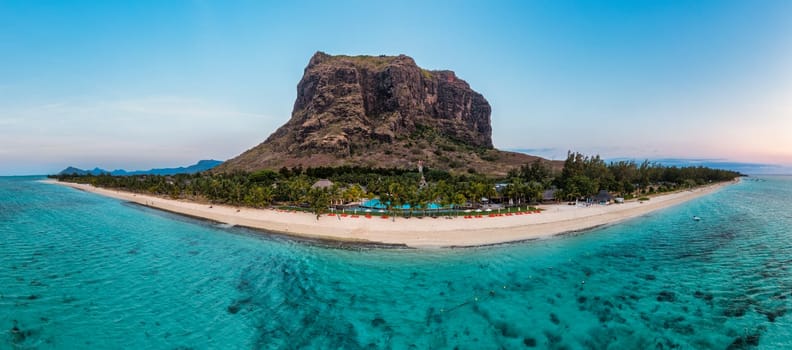 Aerial view of Le morne Brabant in Mauriutius. Tropical crystal ocean with Le Morne mountain and luxury beach in Mauritius. Le Morne beach with palm trees, white sand and luxury resorts, Mauritius.