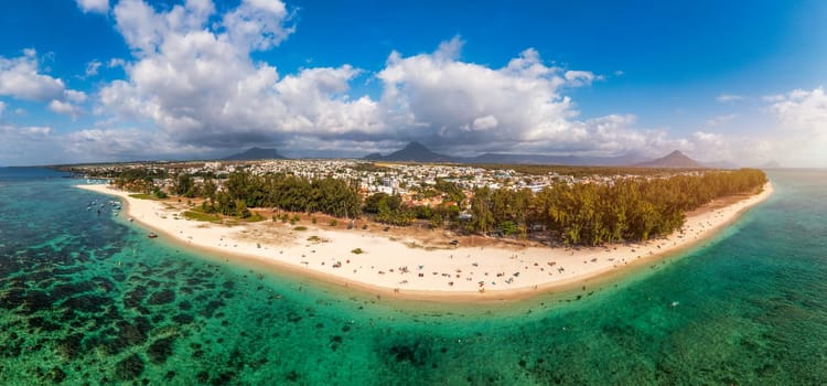 Beautiful Mauritius island with beach Flic en flac. Coral reef around tropical palm beach, Flic en Flac, Mauritius. Aerial view of a beautiful beach along the coast in Flic en Flac, Mauritius.