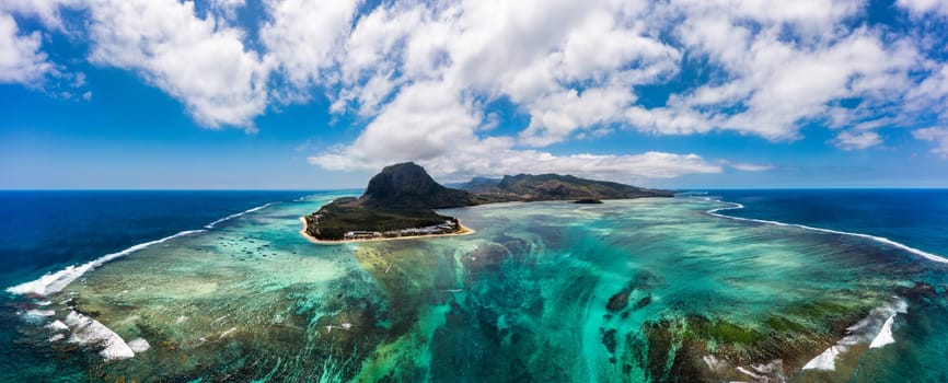 Aerial view of Mauritius island panorama and famous Le Morne Brabant mountain, beautiful blue lagoon and underwater waterfall. Le Morne Brabant peninsula and Underwater Waterfall, Mauritius.