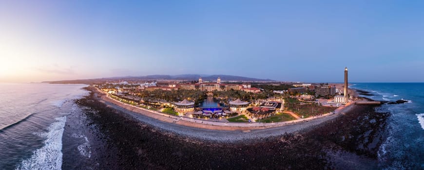 Aerial drone of the popular resort town of Meloneras, with hotels and restaurants, near the Maspalomas dunes in Gran Canaria, Canary Islands, Spain