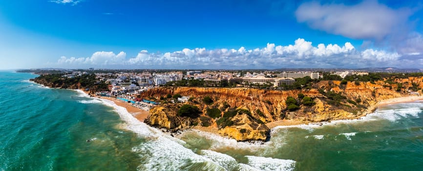 Amazing view from the sky of town Olhos de Agua in Albufeira, Algarve, Portugal. Aerial coastal view of town Olhos de Agua, Albufeira area, Algarve, Portugal.