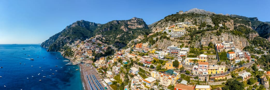 Aerial view of Positano with comfortable beach and blue sea on Amalfi Coast in Campania, Italy. Positano village on the Amalfi Coast, Salerno, Campania. Beautiful Positano, Amalfi Coast in Campania.