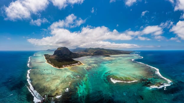 Aerial view of Mauritius island panorama and famous Le Morne Brabant mountain, beautiful blue lagoon and underwater waterfall. Le Morne Brabant peninsula and Underwater Waterfall, Mauritius.