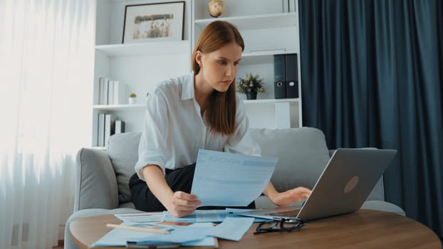 Stressed young woman has financial problems with credit card debt to pay prim from bad personal money and mortgage pay management crisis. Woman worry about financial bankruptcy risk from over spending