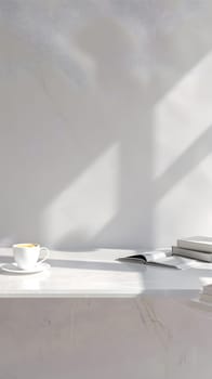 A monochrome photography book rests on a white table with a cup of coffee, surrounded by shades of grey and wooden flooring, creating a peaceful atmosphere