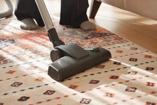 women cleaning with vacuum cleaner carpet
