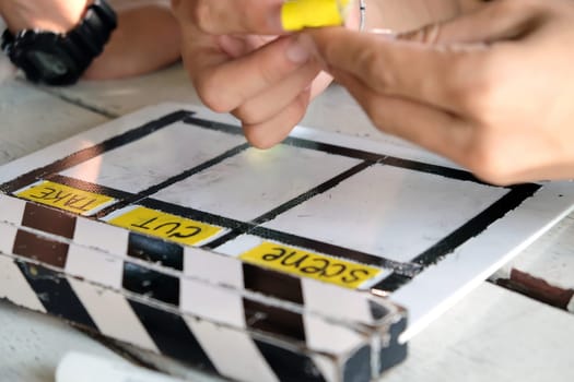 Film production crew, close up of movie Clapper board