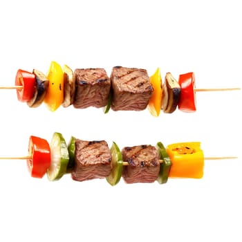 Beef Kabobs with marinated beef cubes bell peppers onions and mushrooms on skewers with steam. Food isolated on transparent background.