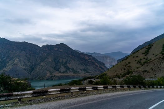 View from the car of an asphalt road in the mountainous area of Dagestan.