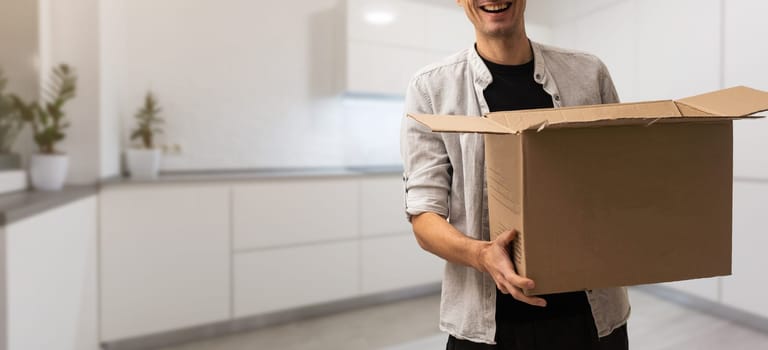 man moving to a new home with box.