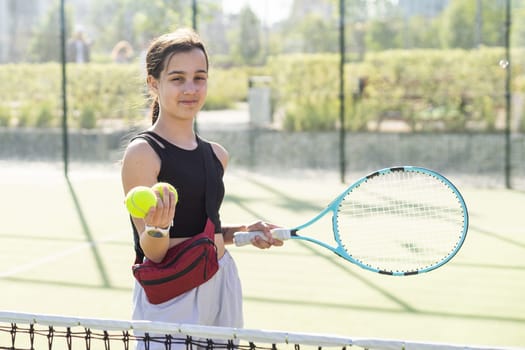 teenage tennis player woman on court with racket. High quality photo