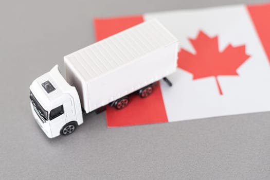 Symbol of National Delivery Truck with Flag of Canada. National Trucking Icon and Canadian flag. High quality photo