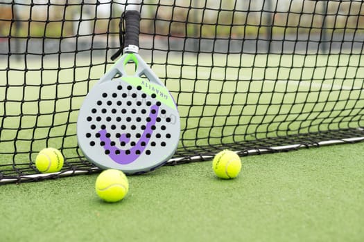 Ukraine Kyiv, April 13 2024. Paddle tennis racket and ball. High quality photo