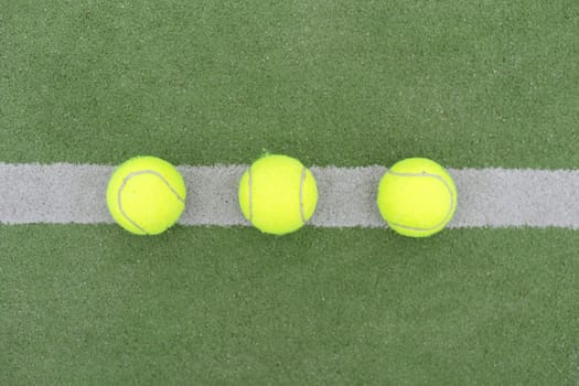 Tennis ball on green grass. High quality photo
