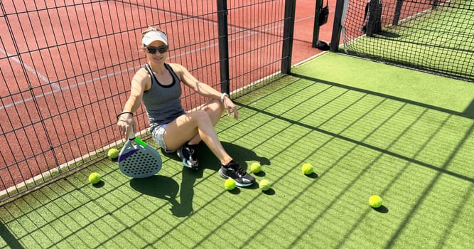 Woman players serving ball. Young adult girl play tennis outside arena. Person racket beat game club. People group hit sport court match. Fit care free time. Run skill train. Padel tennis team workout. High quality FullHD footage