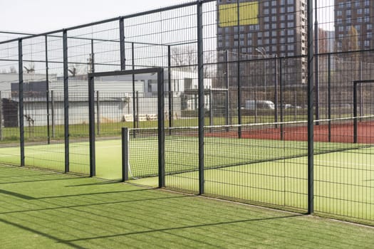 Tennis net on a green field. High quality photo
