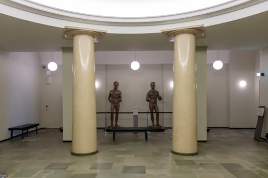 Helsinki, Finland - February 12th 2024 - Photo of Finland parliament building, empty lobby with statues and columns.