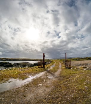 A Wind turbine is generating in Burtonport harbour, Countz Donegal, Ireland.