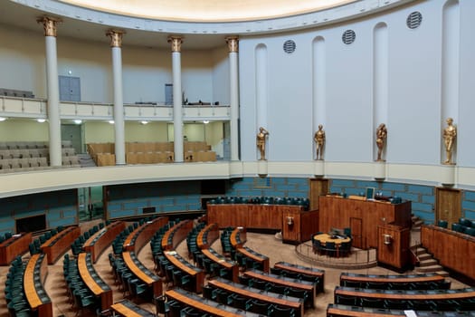 Helsinki, Finland - February 12th 2024 - Photo of Session Hall of Finland Parliament House, empty hall, democratic institute, law, symbols, statues.