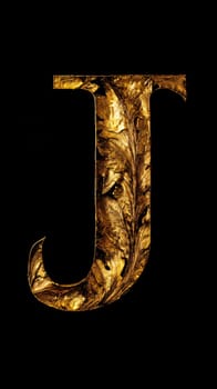 Graphic alphabet letters: The letter J in the old style gold on a black background.