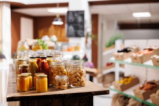 Products sold in bulk in zero waste store to minimize plastic usage, reducing pollution for a sustainable lifestyle. Ecofriendly pantry staples ready to be bought by consciously living customers