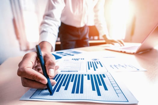 Businessman accountant or financial expert analyze business report graph and finance chart at corporate office. Concept of finance economy, banking business and stock market research. uds