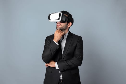 Smart caucasian businessman thinking and planning strategy while using VR glasses. Professional project manager checking financial plan and enter and visit metaverse while wearing headset. Deviation.