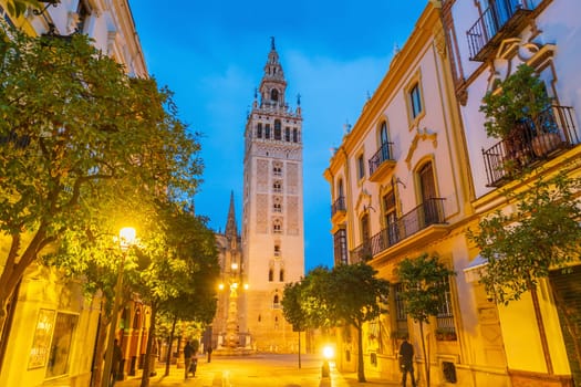 Giralda tower and Seville Cathedral in downtown Spain at sunset