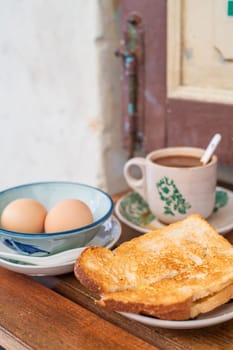 Traditional oriental Chinese kopitiam style in Melaca Malysia eggs bread and coffee 