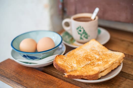 Traditional oriental Chinese kopitiam style in Melaca Malysia eggs bread and coffee 