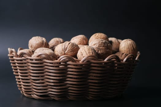 walnuts in a bowl on black background ,