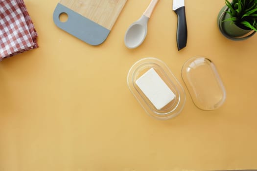 fresh butter in a glass jar on table .