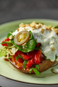 Baked sweet potato with cherry tomatoes, roasted bell peppers, spicy pickled jalapeno slice, fresh greens and stracciatella topped with toasted hazelnut crumbles. Harmony of tastes and colors