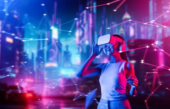 Female standing in cyberpunk style building in meta wear VR headset connecting metaverse, future cyberspace community technology. Woman touching goggle looking far virtual construction. Hallucination.