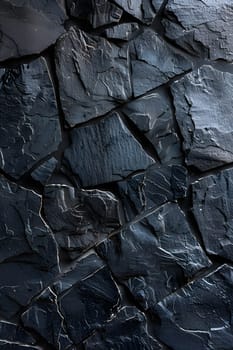 A closeup photo of a grey automotive tire tread pattern against a black rock wall, resembling a road surface. The contrast between the textures of the tire and the bedrock creates a striking image