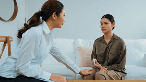 Supportive and comforting hands cheering up depressed patient person or stressed mind with empathy. Psychologist reassuring stressful and sad patient in vivancy clinic.