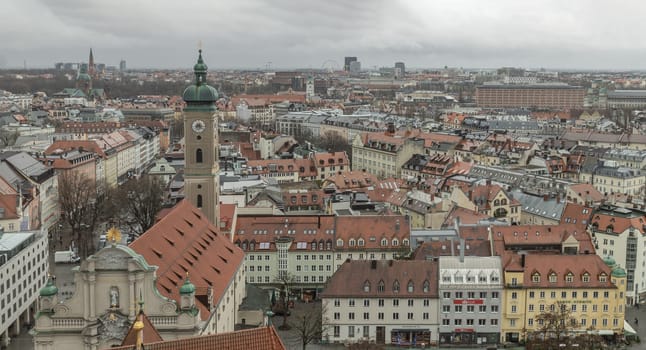 Munich, Germany - Dec 22, 2023 - Panorama view of Aerial view of Tower of St. Peter's Church and surrounding buildings. The Church of St. Peter, Downtown view, Space for text, Selective focus.