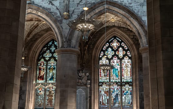 Edinburgh, Scotland - Jan 18, 2024 - Beautiful Chandelier and Glass stained window inside of The thistle chapel in St Giles' Cathedral or the High Kirk. The most important place of worship in the Edinburgh, Space for text, Selective focus.