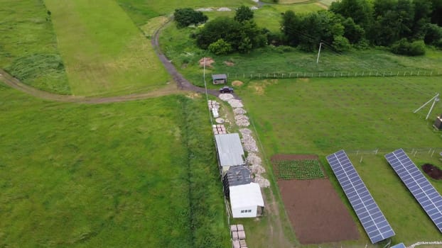 Aerial view of Solar Panels Farm solar cell with sunlight. Drone flight over solar panels field, renewable green alternative energy concept