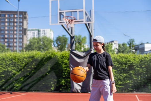 Concentration. Teen girl, basketball player in motion with ball, dribbling. Concept of sportive lifestyle, active hobby, health, endurance, competition. High quality photo