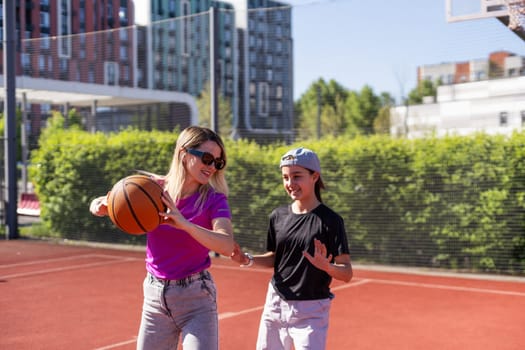 mother and daughter play basketball. High quality