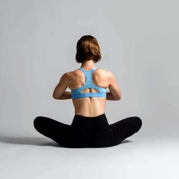 Full body length back rear view gaiety shot athletic and sporty woman doing healthy and meditative yoga exercise workout posture on isolated background. Healthy active and body care lifestyle